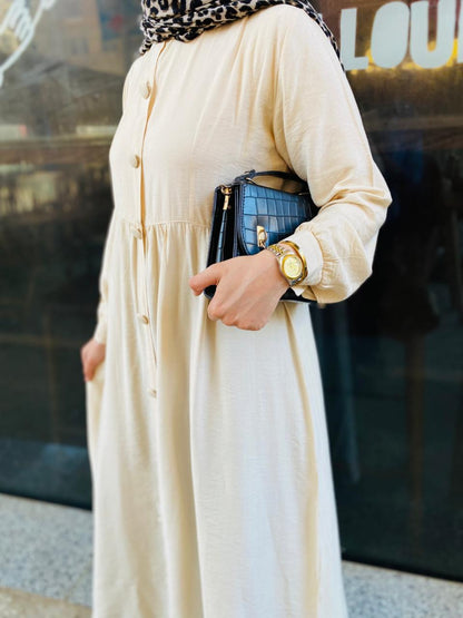 Creamy button-front flared dress.