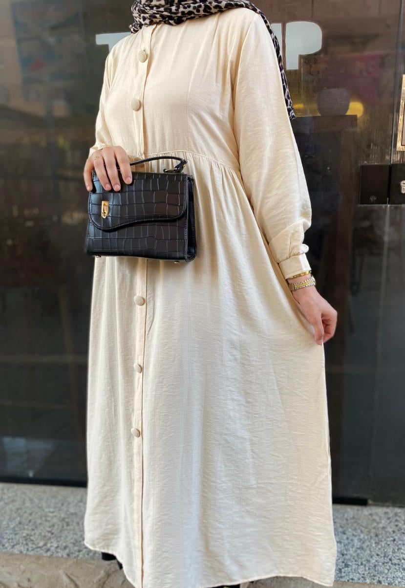 Creamy button-front flared dress.