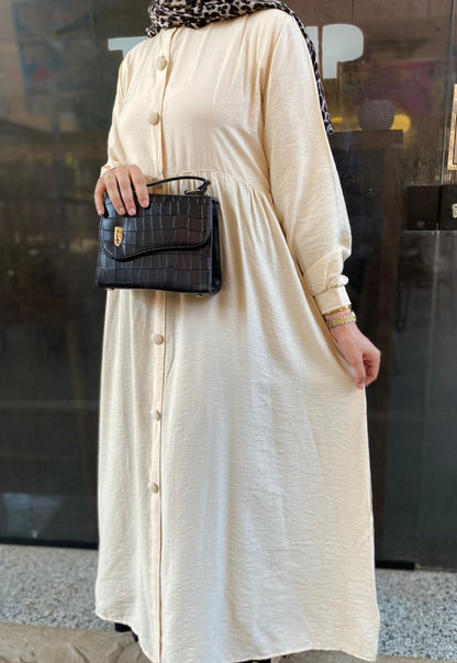 Creamy button-front flared dress.